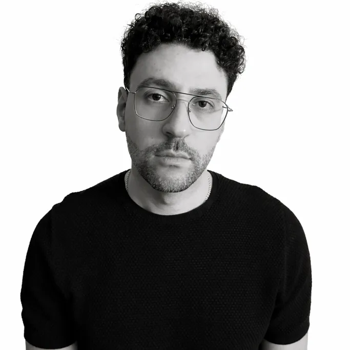Zuzzon in a moody black-and-white portrait